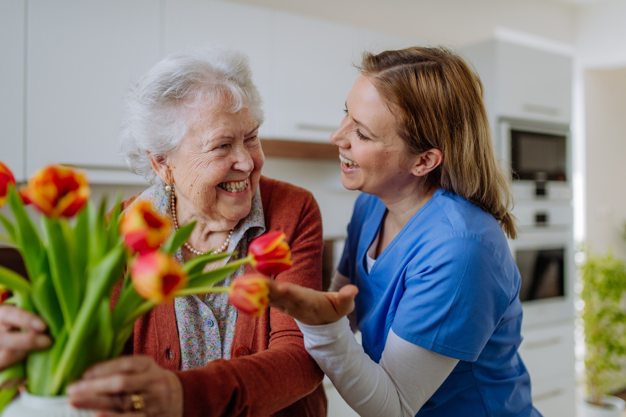 woman looking at flowers